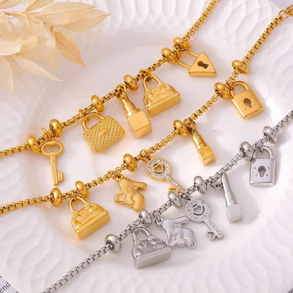 Bijoux Charm Bracelet à charms doré avec clips et clé brillante