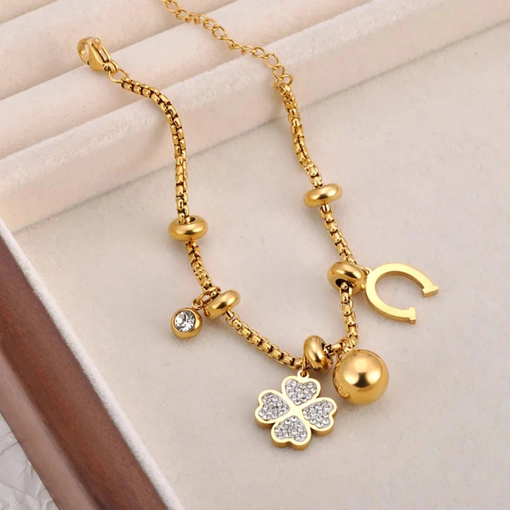 Bijoux Charm Bracelet en or avec charms et clips, orné d'un trèfle à 4 feuilles