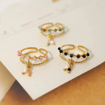 Bijoux Charm Bague à charms blanches et noires dorées