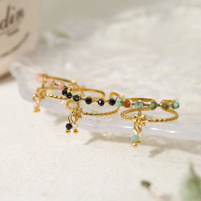 Bijoux Charm Bague à charms blanches et noires dorées