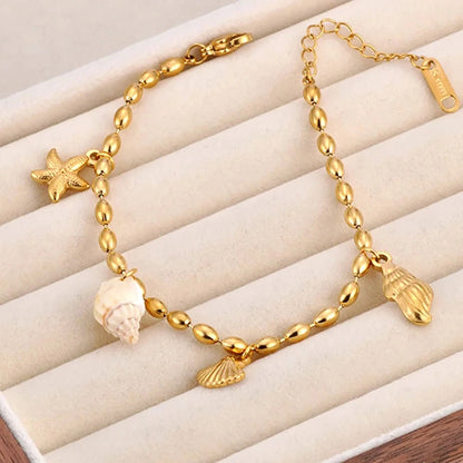 Bijoux Charm Bracelet doré à charms avec coquillage élégant