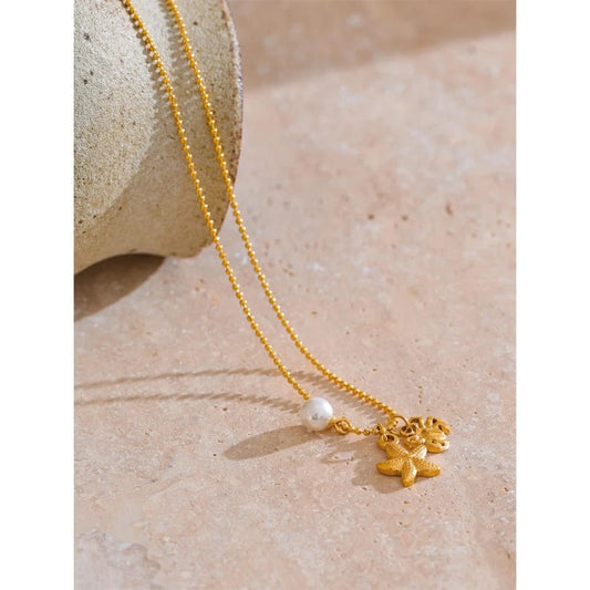 Bijoux Charm Collier à 3 charms perle étoile et crabe doré