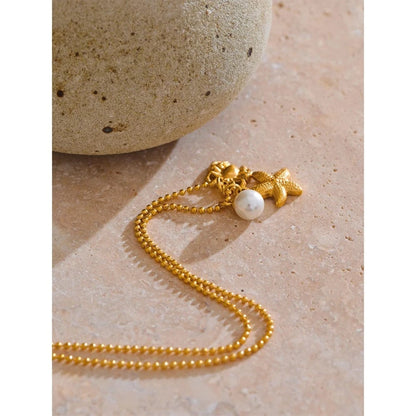 Bijoux Charm Collier à 3 charms perle étoile et crabe doré