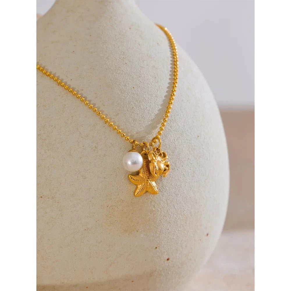 Bijoux Charm Collier à 3 charms perle étoile et crabe doré