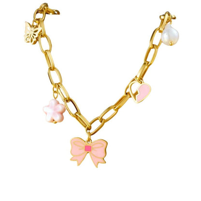 Bijoux Charm Collier à charms doré et nœud papillon rose