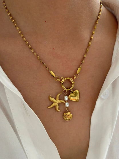 Bijoux Charm Collier à charms étoile, cœur et grelot dorés