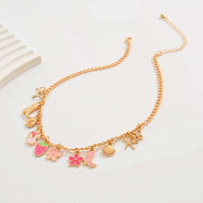 Bijoux Charm Collier charm fleur et fraise doré
