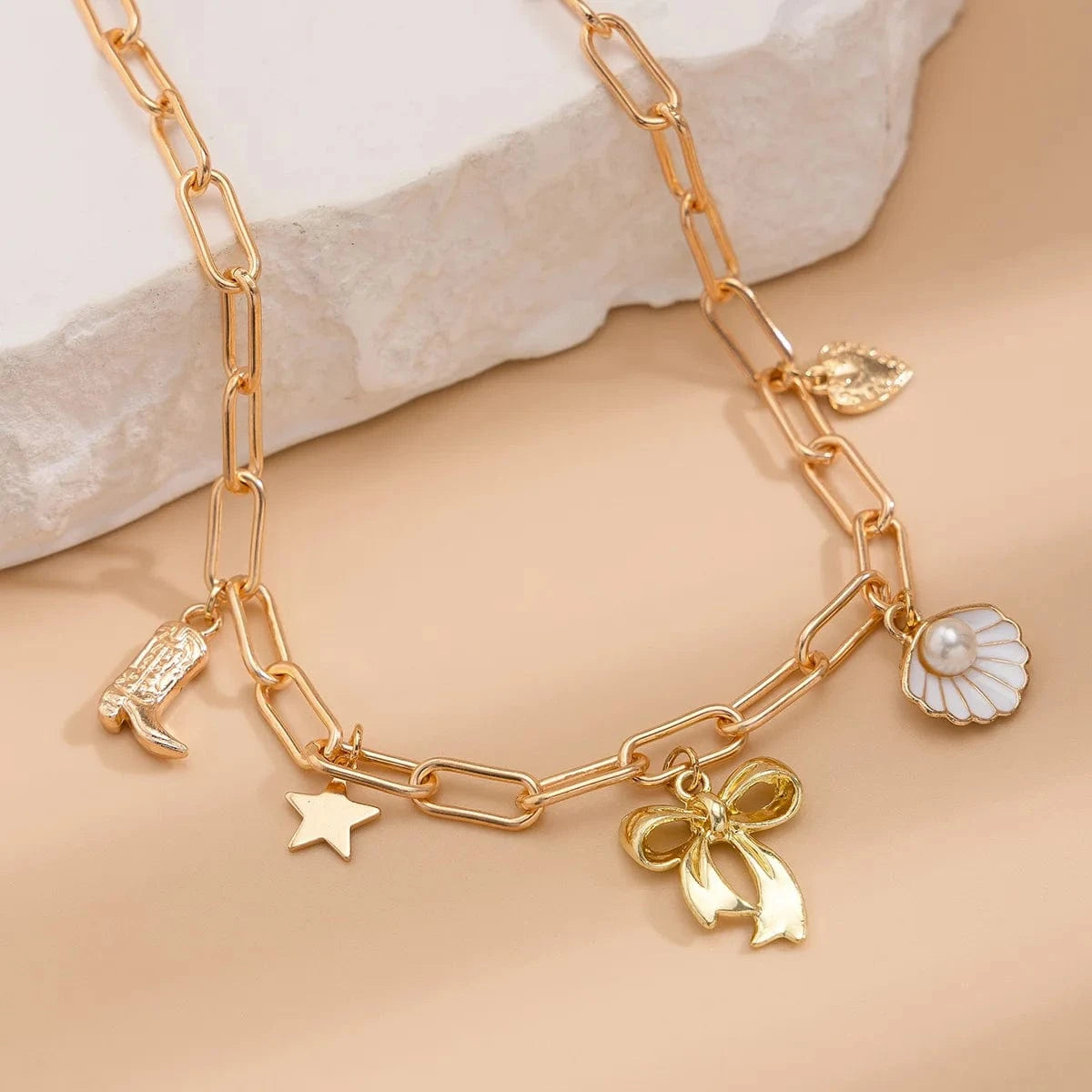 Bijoux Charm Collier charm noeud papillon doré
