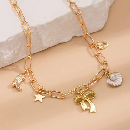 Bijoux Charm Collier charm noeud papillon doré