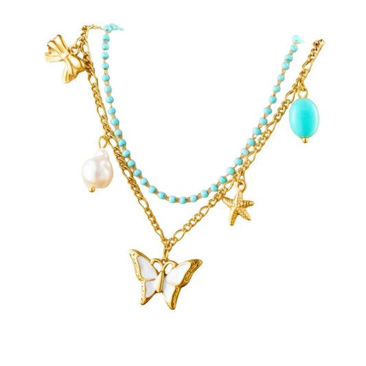 Bijoux Charm Double collier à charms doré avec papillon blanc et perle.